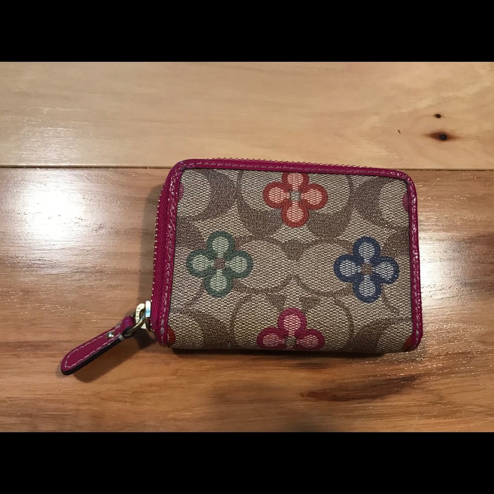Coach mini zip wallet.